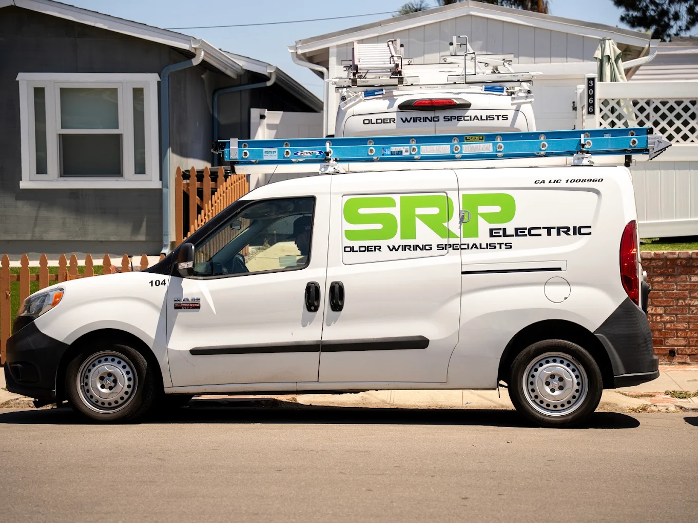 SRP Electric service van parked in front of a residential home